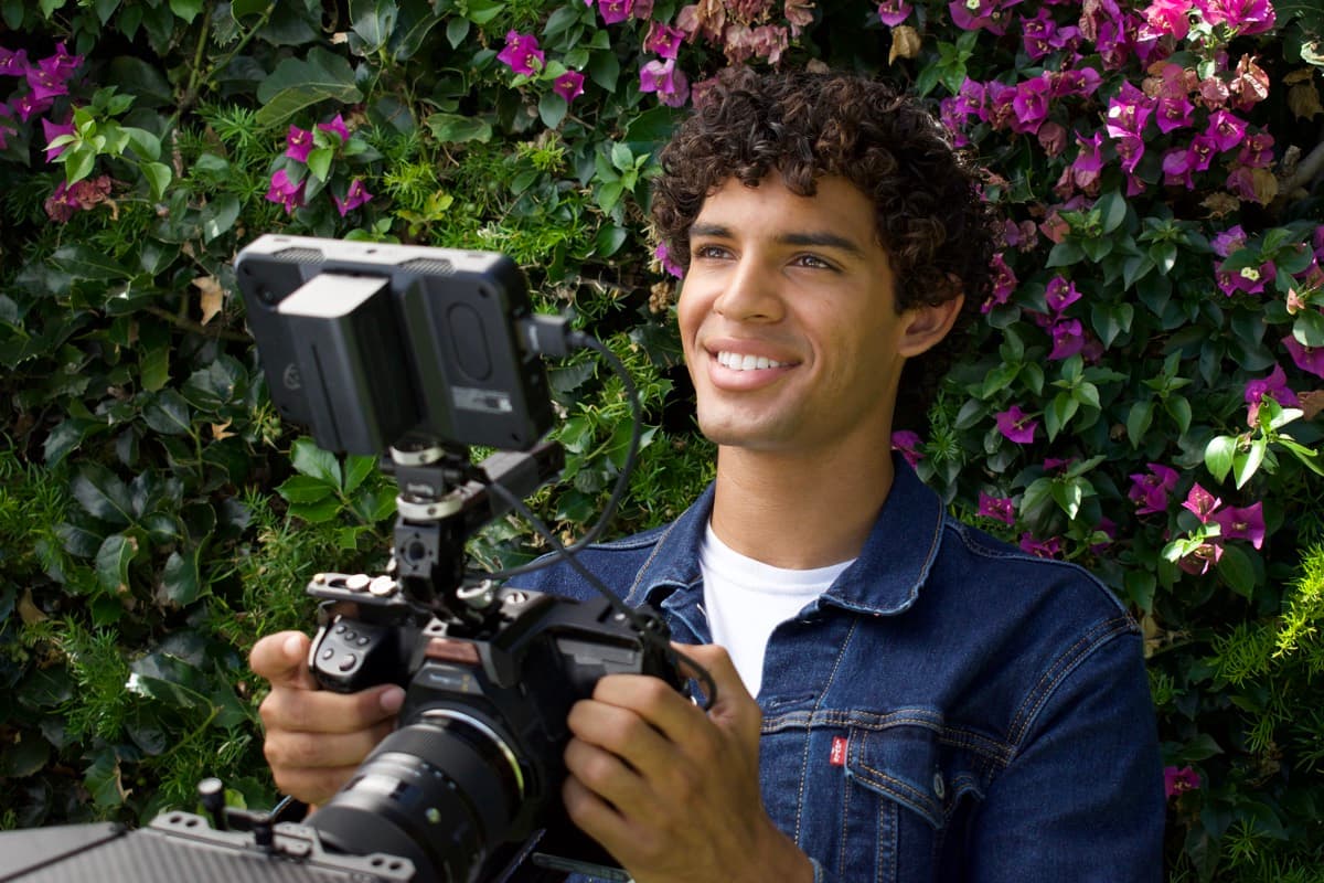 Filming against a bougainvillea wall in the San Fernando Valley